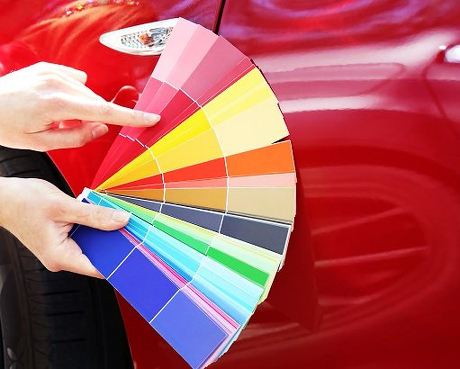 Choosing a custom paint color from swatches on a red car