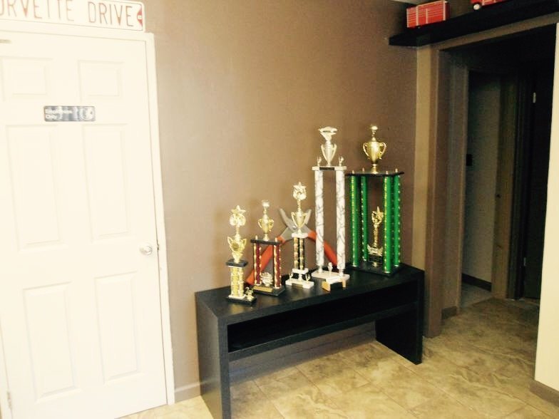 Award trophies at Auto Body Creationz